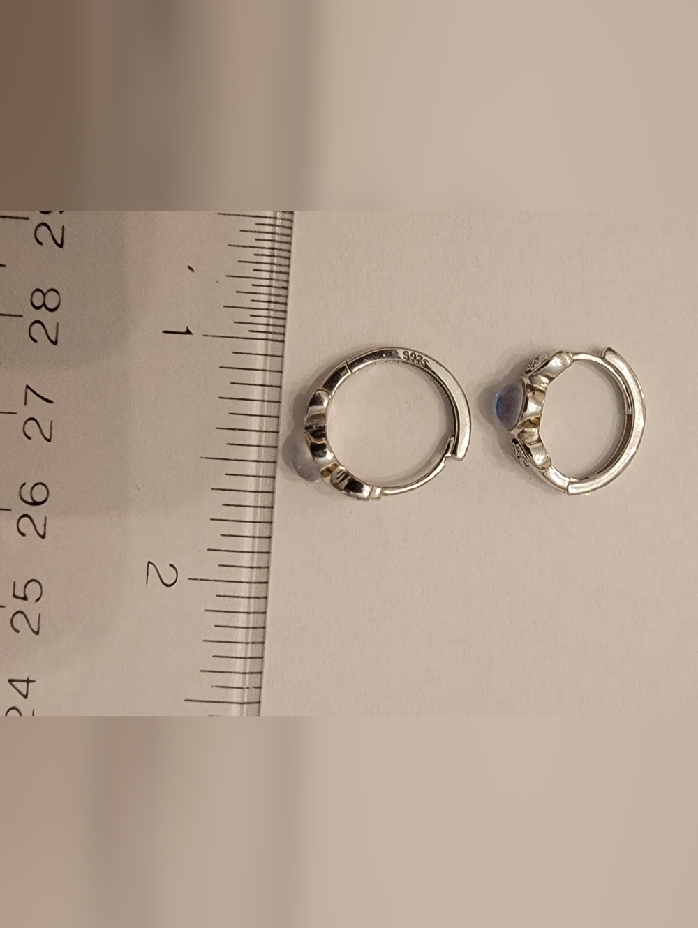 Silver Hoop Huggie Earrings with Blue Stone Accent
